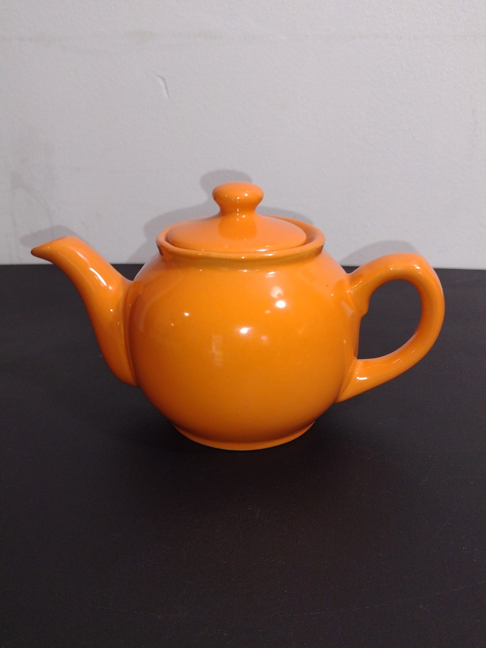 Bright Orange Ceramic Teapot with Classic Round Shape